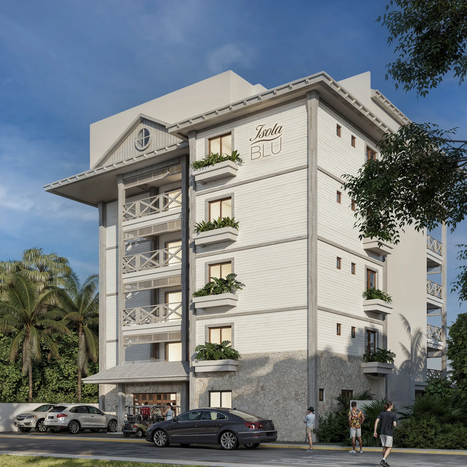 Fachada del edificio Isola Blu Chic Condos en Isla Mujeres, con palmeras y vegetación tropical